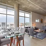 Gaze At Sprawling Green Vistas Through Walls Of Windows